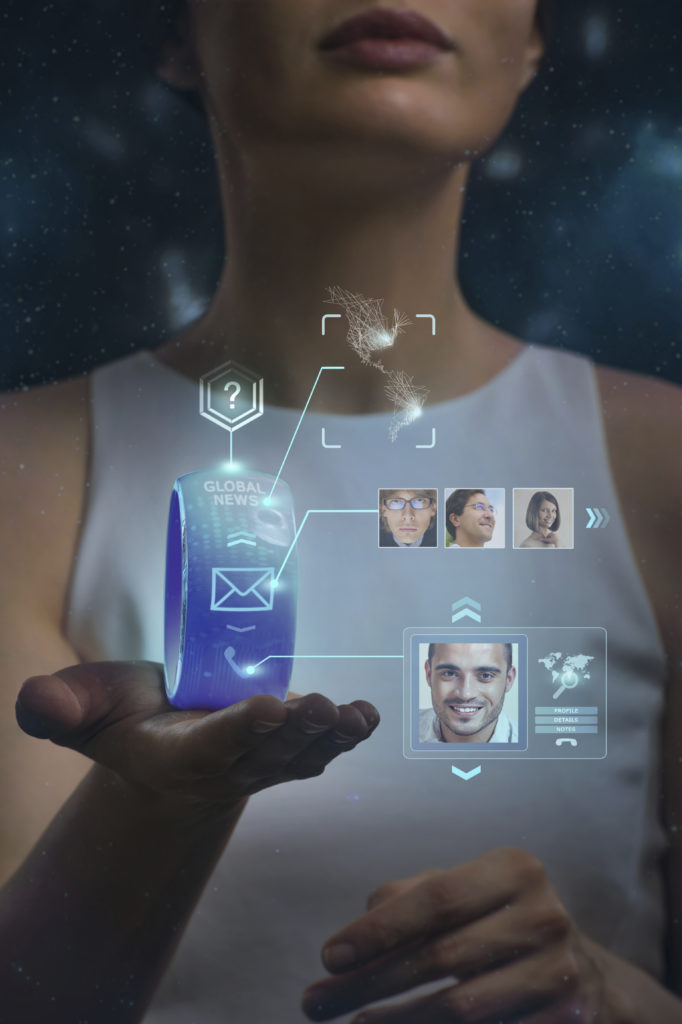 Unrecognizable woman holding wearable gadget. New technologies. Wireless tools. Future communications and social media concept.